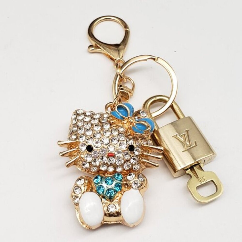 Louis Vuitton Gold Lock 🔒 Authentic LV Key + Unbranded Hello Kitty Bag Charm - Picture 3 of 7